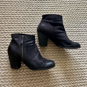 Black leather ankle booties with side zip and stacked heel